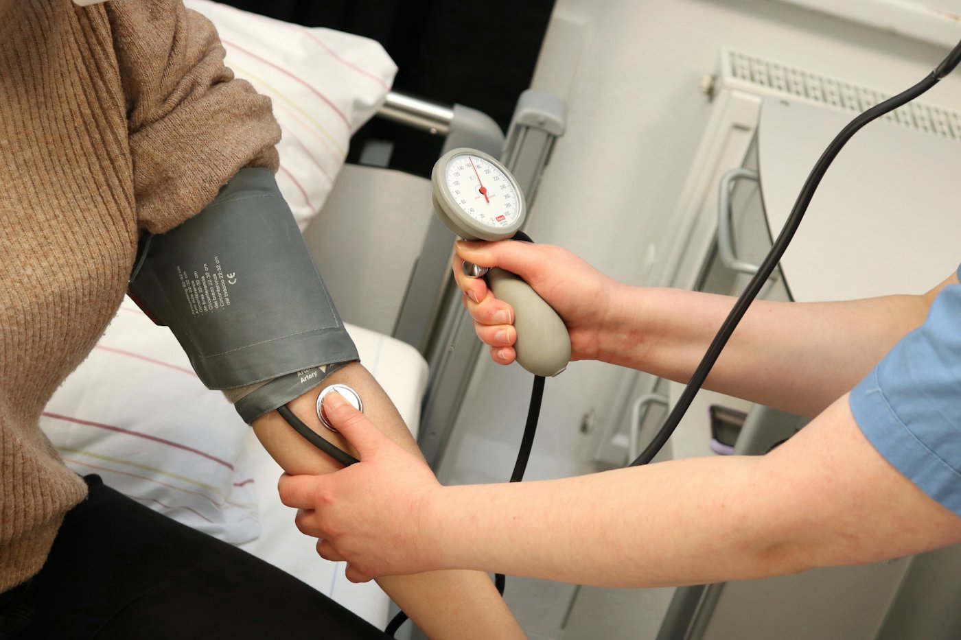 Nurse taking a patient's blood pressure