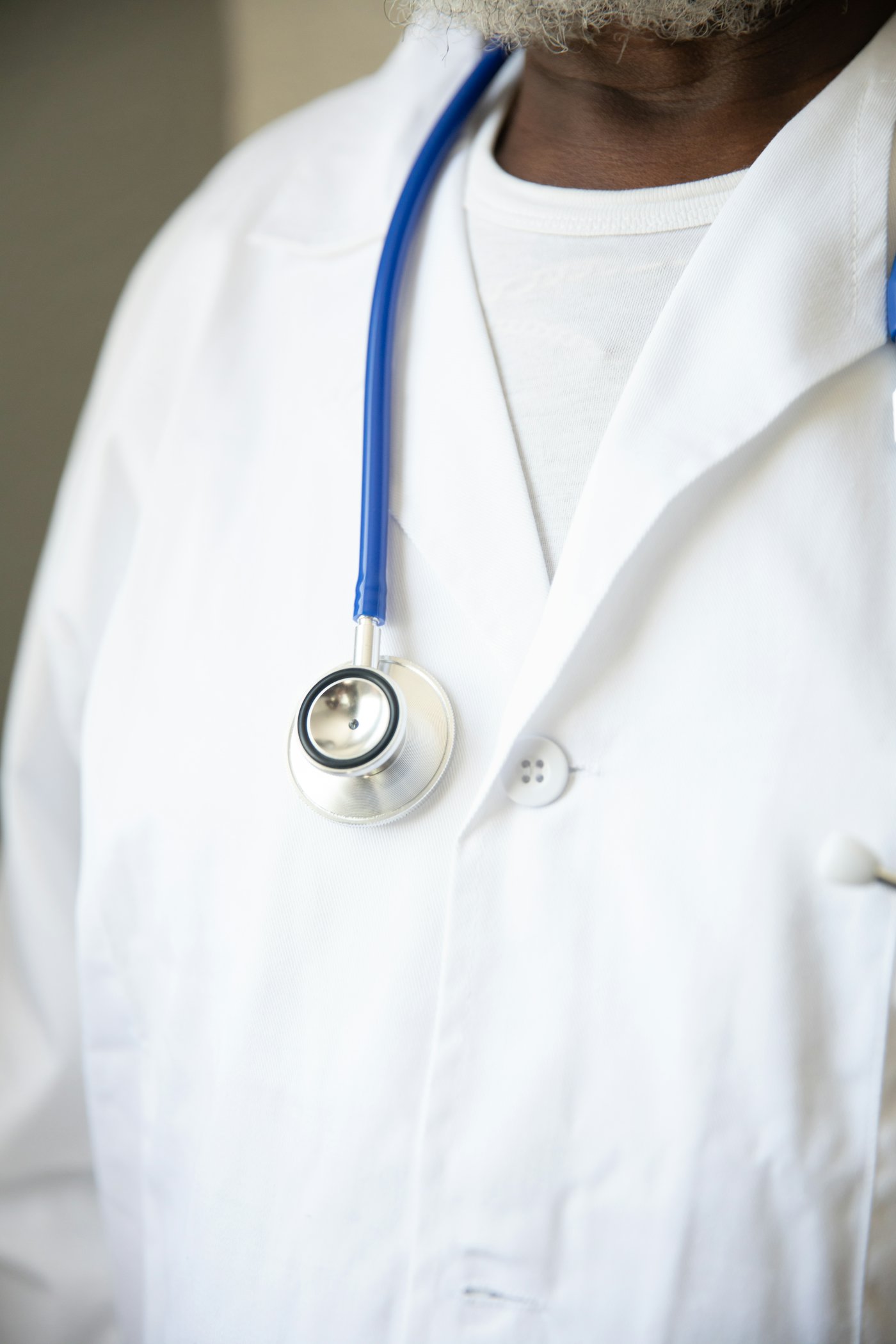 Physician's white coat and stethoscope